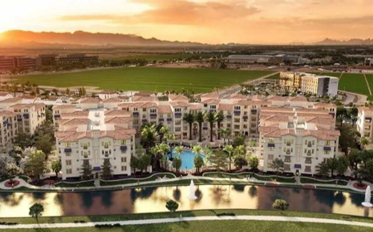 A vibrant exterior scene featuring a sparkling swimming pool, a decorative fountain, landscaped gardens, and modern architecture. The area is set up for relaxation and socializing, with palm trees and comfortable seating nearby.